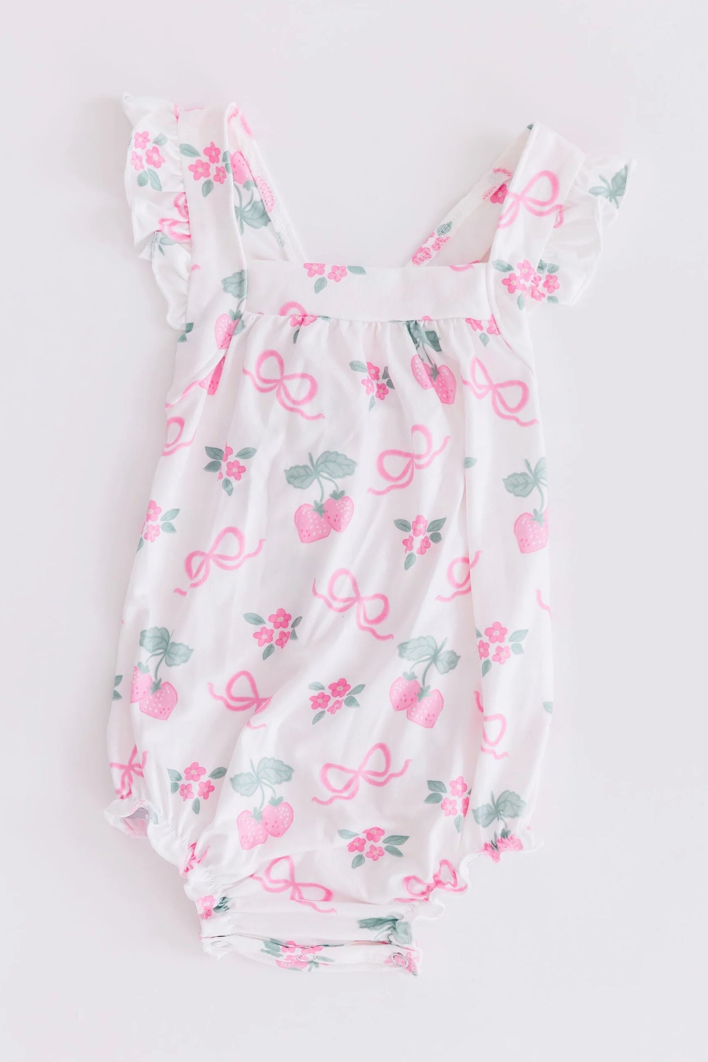 BERRIES & BOWS RUFFLE CROSS BACK ROMPER